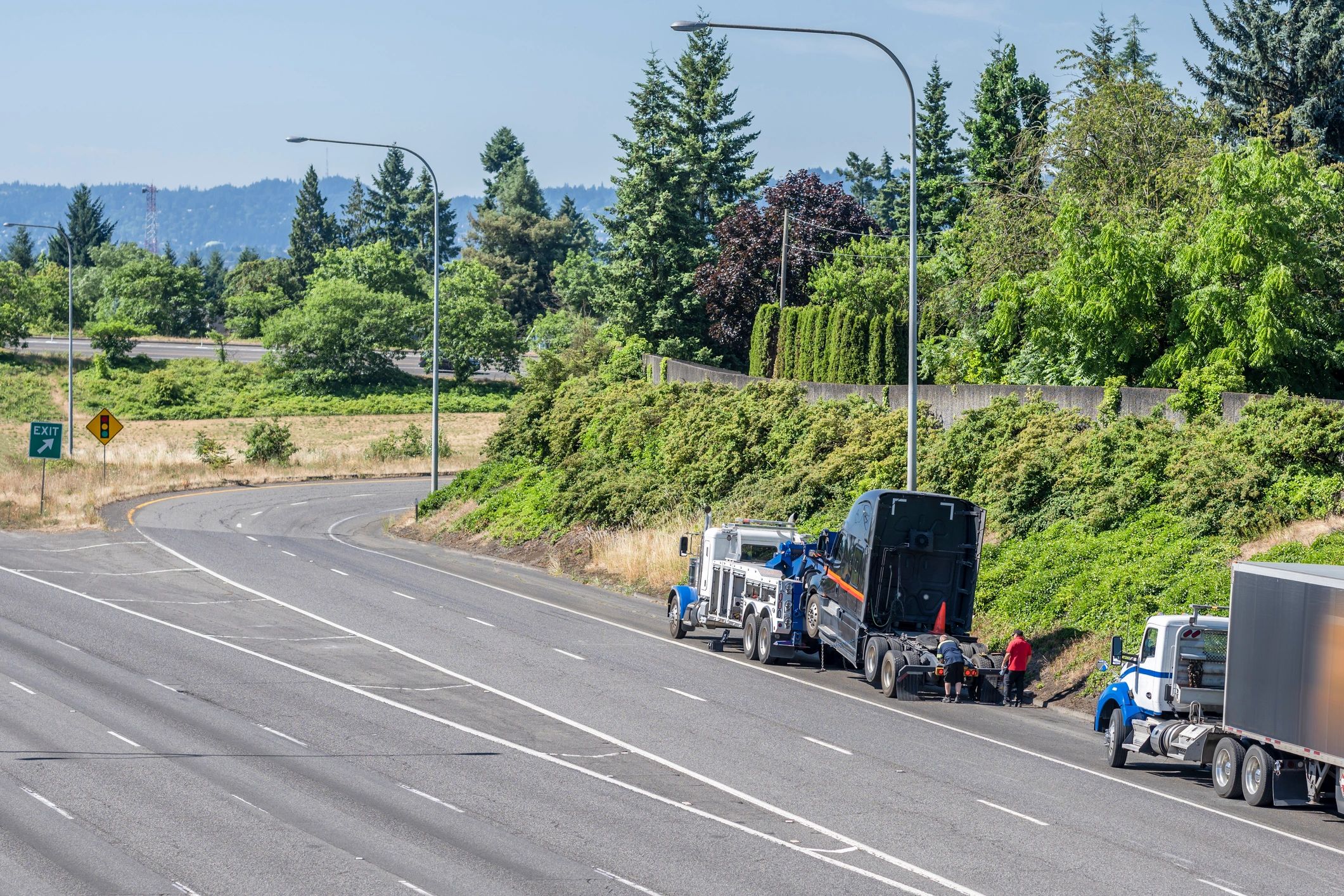Mobile truck repair technician working on a commercial vehicle